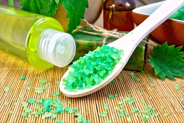 Salt and toiletries with nettles on board — Stock Photo, Image