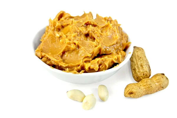 Butter peanut in the bowl with nuts — Stock Photo, Image