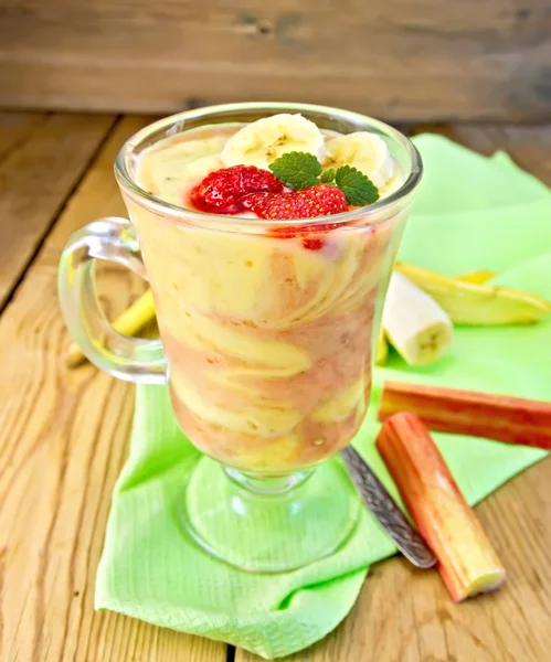 Dessert milk with rhubarb and banana on board — Stock Photo, Image