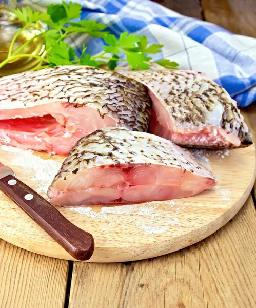 Bream crude pieces with knife on board — Stock Photo, Image