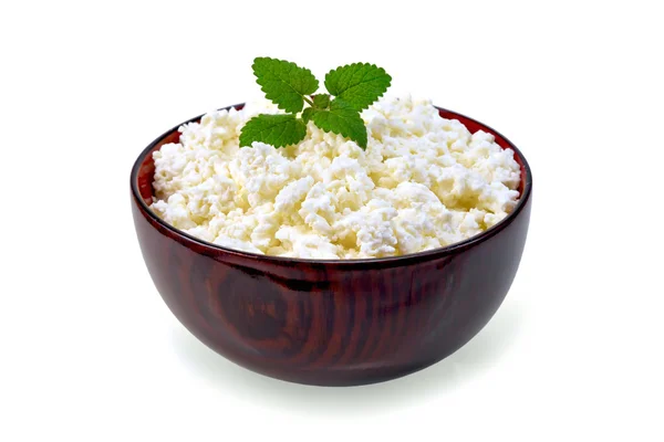 Curd in wooden bowl with mint — Stock Photo, Image