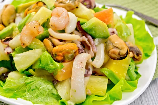 Salad seafood and lettuce on light board — Stock Photo, Image