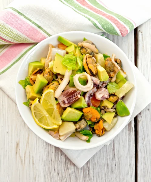 Salad seafood and avocado on white board — Stock Photo, Image