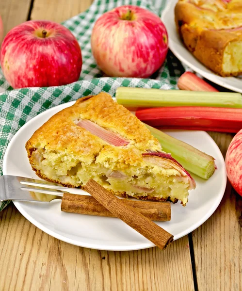 Pie with apple and rhubarb in plate on board — Stock Photo, Image