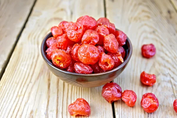 Candied cherries in bowl on board — Stock Photo, Image