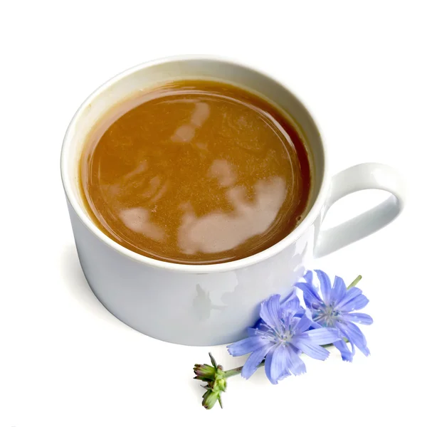 Chicory drink in white cup with blue flower — Stock Photo, Image