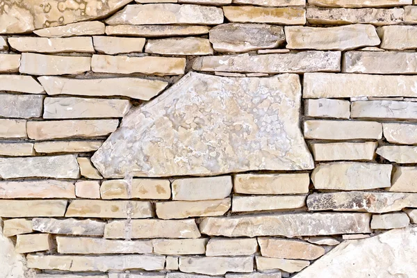 Wall from different stones — Stock Photo, Image