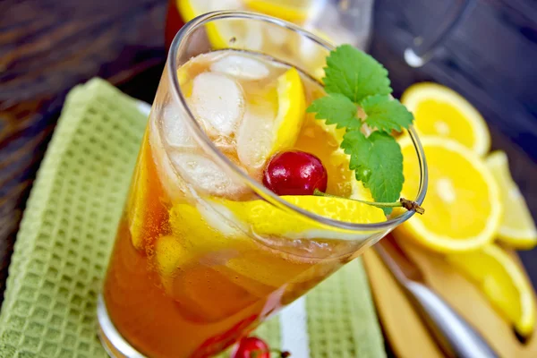 Lemonade with cherry in glassful on board — Stock Fotó