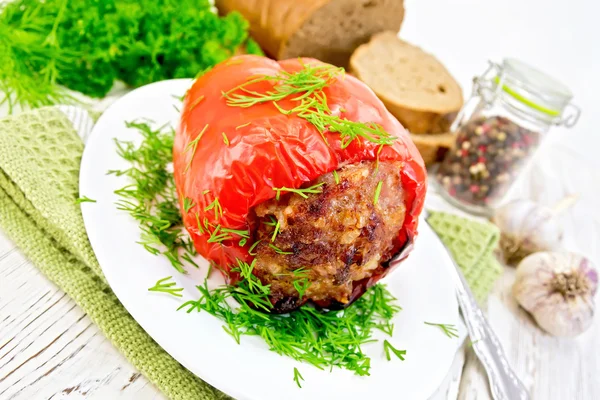 Pepper stuffed meat with dill in plate on table — 스톡 사진