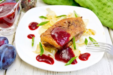 Duck breast whole with plum sauce and cabbage in plate