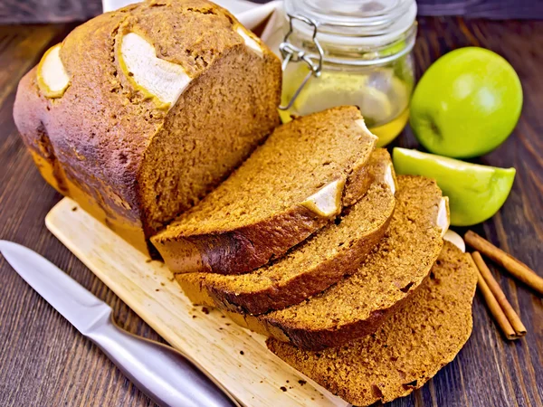 Bread apple with honey on dark board — Stock Photo, Image