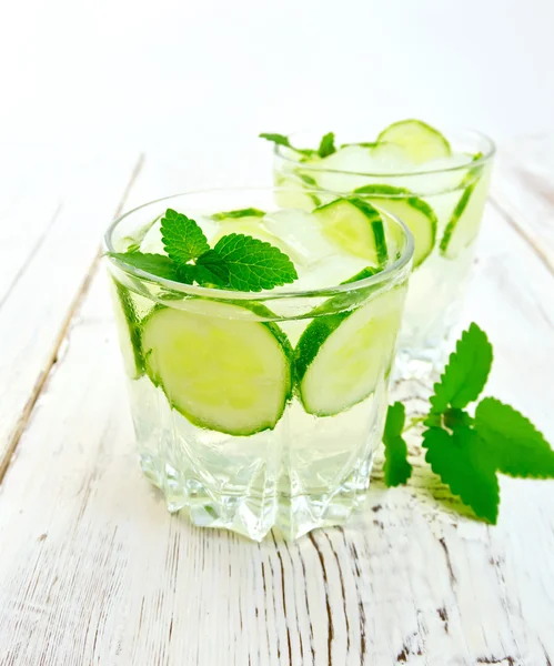 Lemonade with cucumber and mint on board — Stok fotoğraf