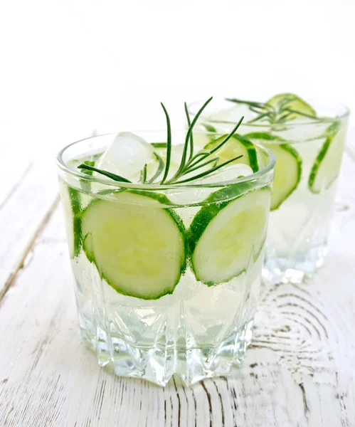 Lemonade with cucumber and rosemary in two glassful on table — Stock fotografie