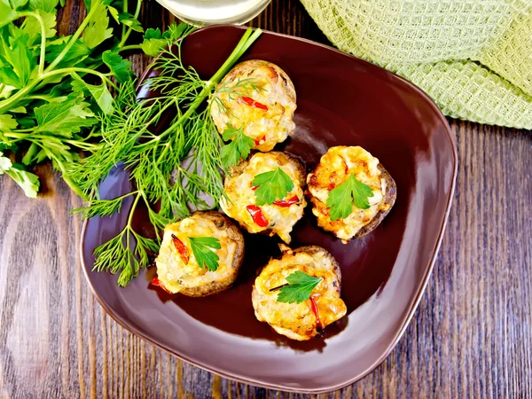 Champignons stuffed meat in brown plate on board top — Stock Photo, Image