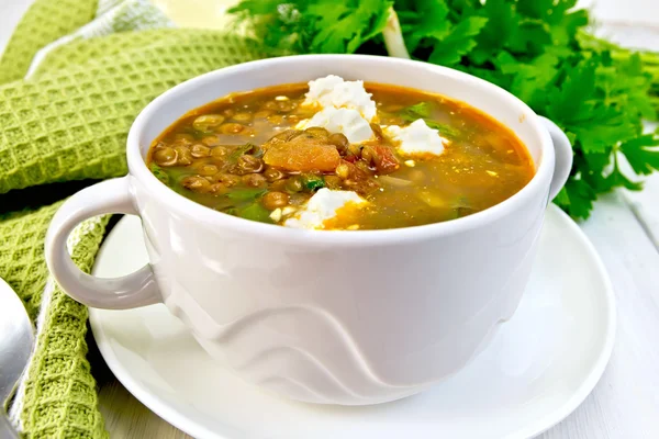 Soup lentil with spinach and feta on board — Stock Photo, Image