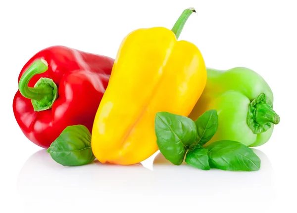 Red, yellow and green bell peppers with leaves isolated on white — Stock Photo, Image