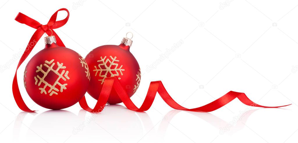 Two red Christmas decoration baubles with ribbon bow isolated on a white background