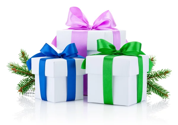 Three White boxs tied with colored satin ribbons bow and pine tr — Stock Photo, Image