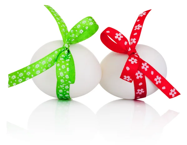 Two Easter eggs with festive bow isolated on white background — Stock Photo, Image