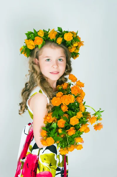 Beautiful girl and wild flowers — Stock Photo, Image