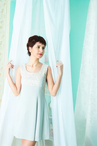Graceful girl and curtain — Stock Photo, Image