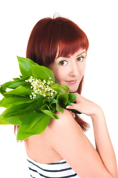 The girl with a bouquet of lilies of the valley — Stock Photo, Image