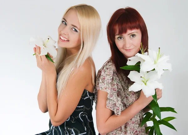 Girls with lilies — Stock Photo, Image