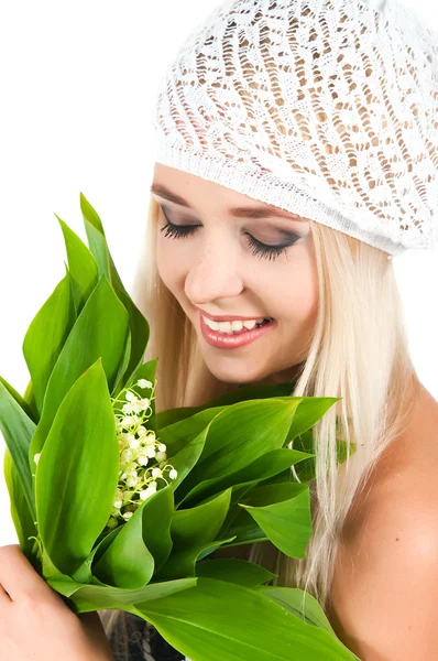 Blond girl with a bouquet of lilies of the valley — Stock Photo, Image