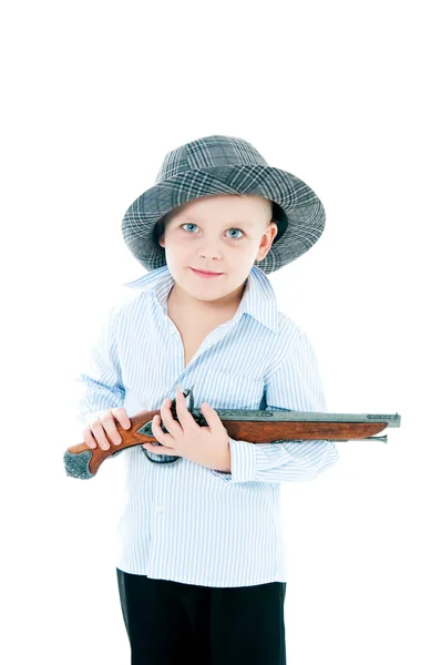Chlapec v klobouku s pistolí — Stock fotografie
