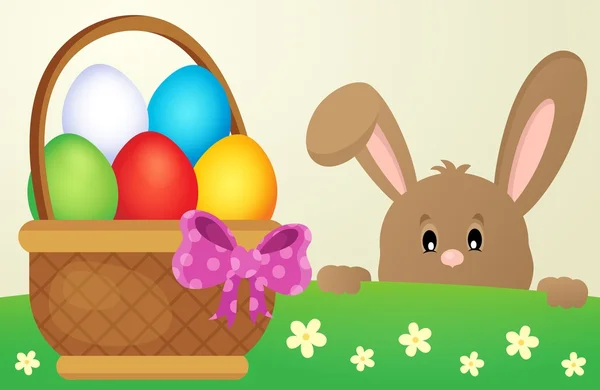 Loerende Easter bunny en ei basket — Stockvector