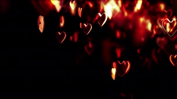 Movimiento de los corazones con profundidad de campo sobre fondo negro — Vídeos de Stock