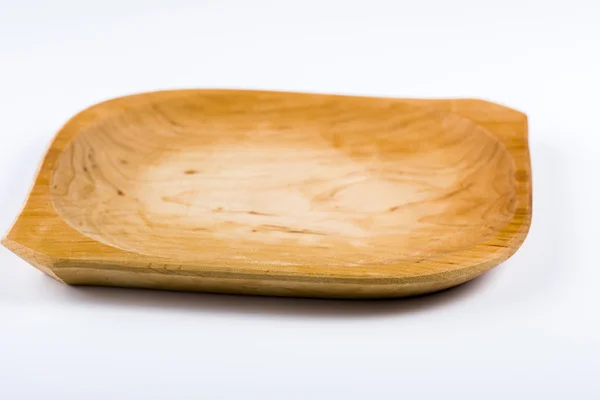 Wooden plate on a white background — Stock Photo, Image