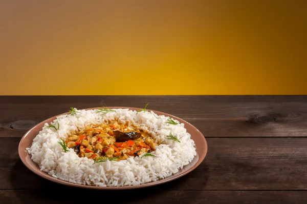 Rice on brown plate — Stock Photo, Image