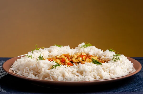 Rice on brown plate — Stock Photo, Image