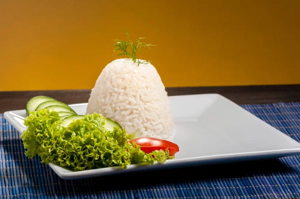 Rice on white plate — Stock Photo, Image