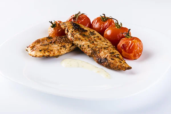 Grilled chicken breast on white plate — Stock Photo, Image