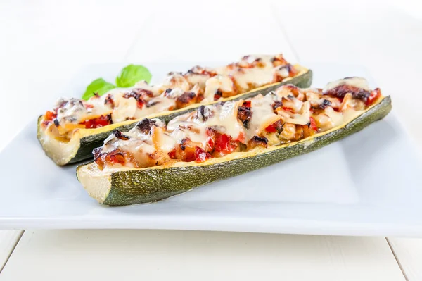 Stuffed zucchini on white plate — Stock Photo, Image