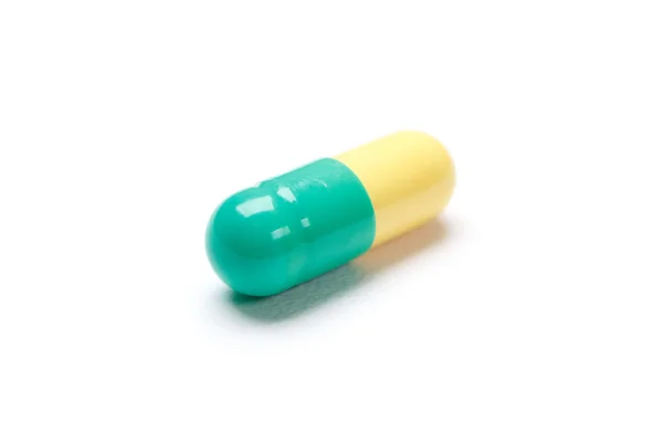 Green colored pill — Stock Photo, Image