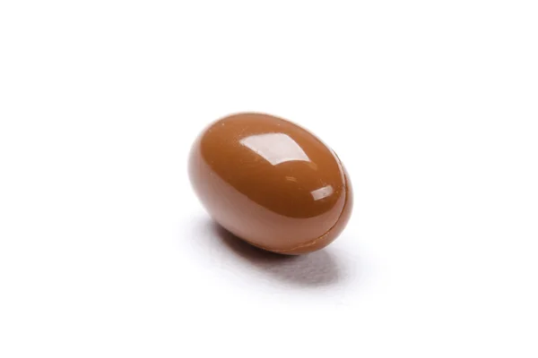 Brown pill on white background — Stock Photo, Image