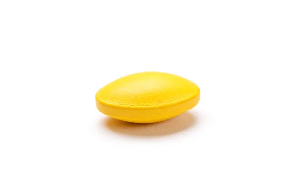 Yellow pill, isolated on white — Stock Photo, Image