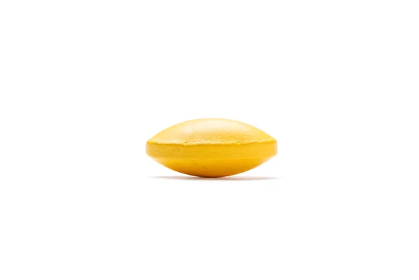 Yellow pill, isolated on white background — Stock Photo, Image