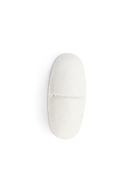 Белая таблетка, изолированная — стоковое фото
