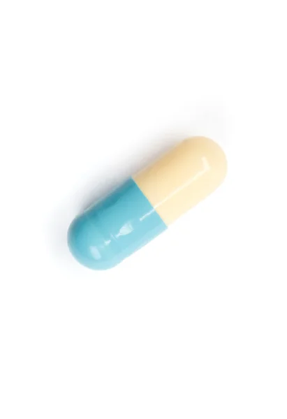 Blauwe capsule, geïsoleerd op wit — Stockfoto