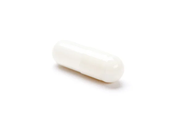 White capsule, isolated background — Stock Photo, Image