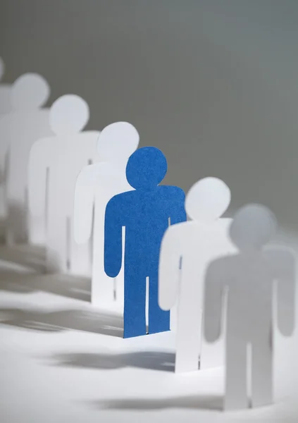 Group of paper men standing in a row — Stock Photo, Image