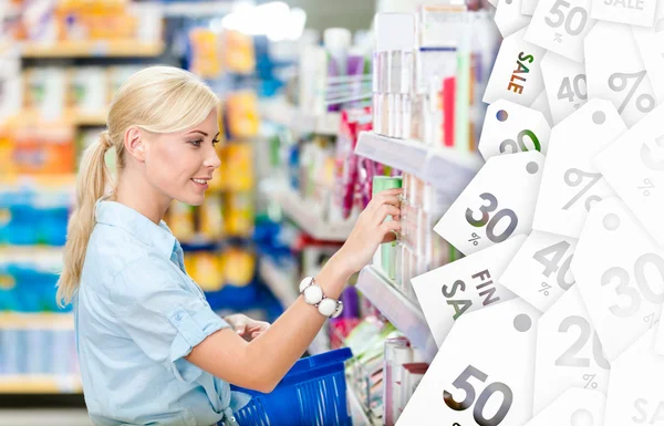 Profile of girl at the shop choosing cosmetics. Clearance sale — Stock Photo, Image