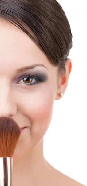 Woman with cosmetic brush Royalty Free Stock Photos