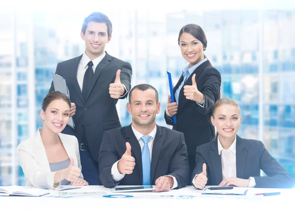 Group of thumbing up managers — Stock Photo, Image