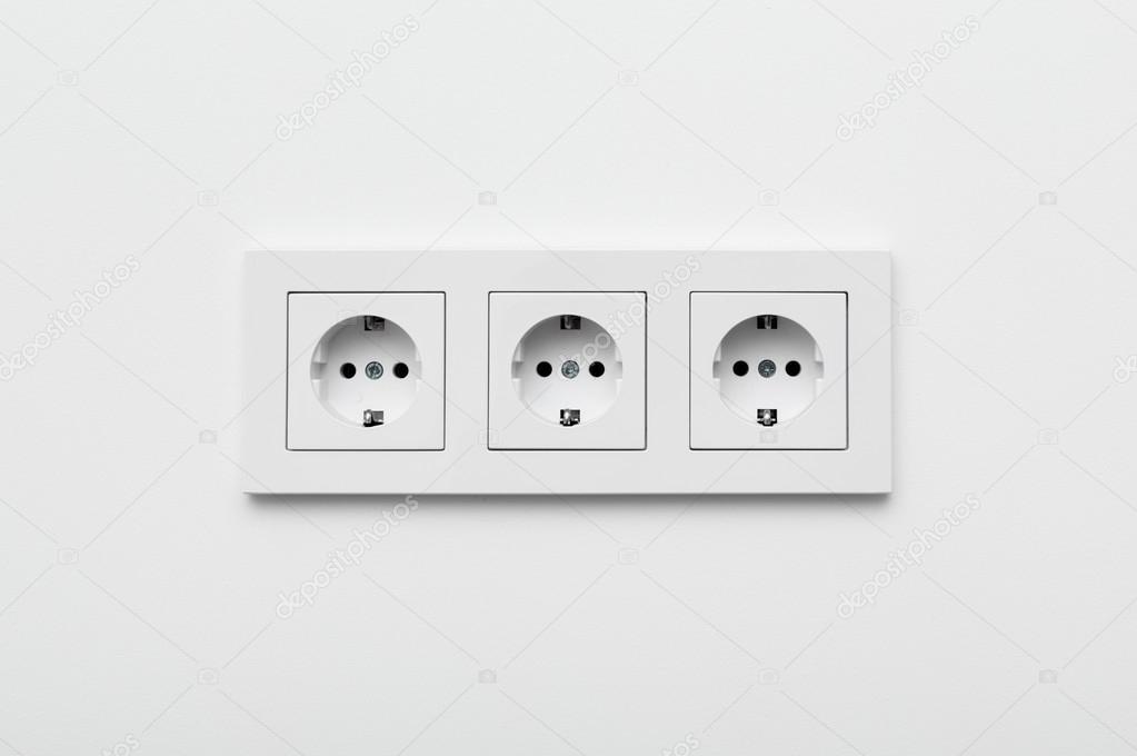 Set of three sockets on the wall