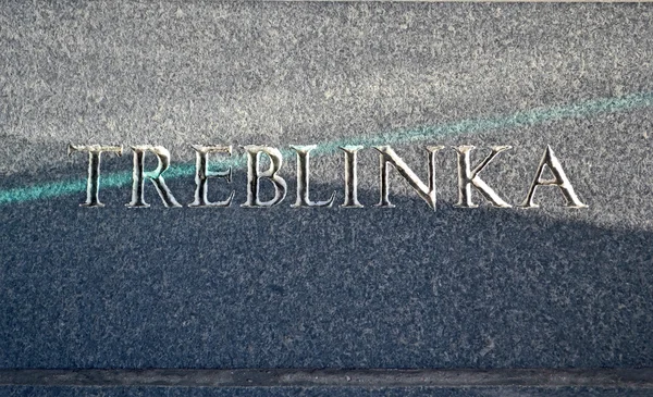 Konzentrationslager Treblinka, Text Nahaufnahme auf Steinmauer. — Stockfoto